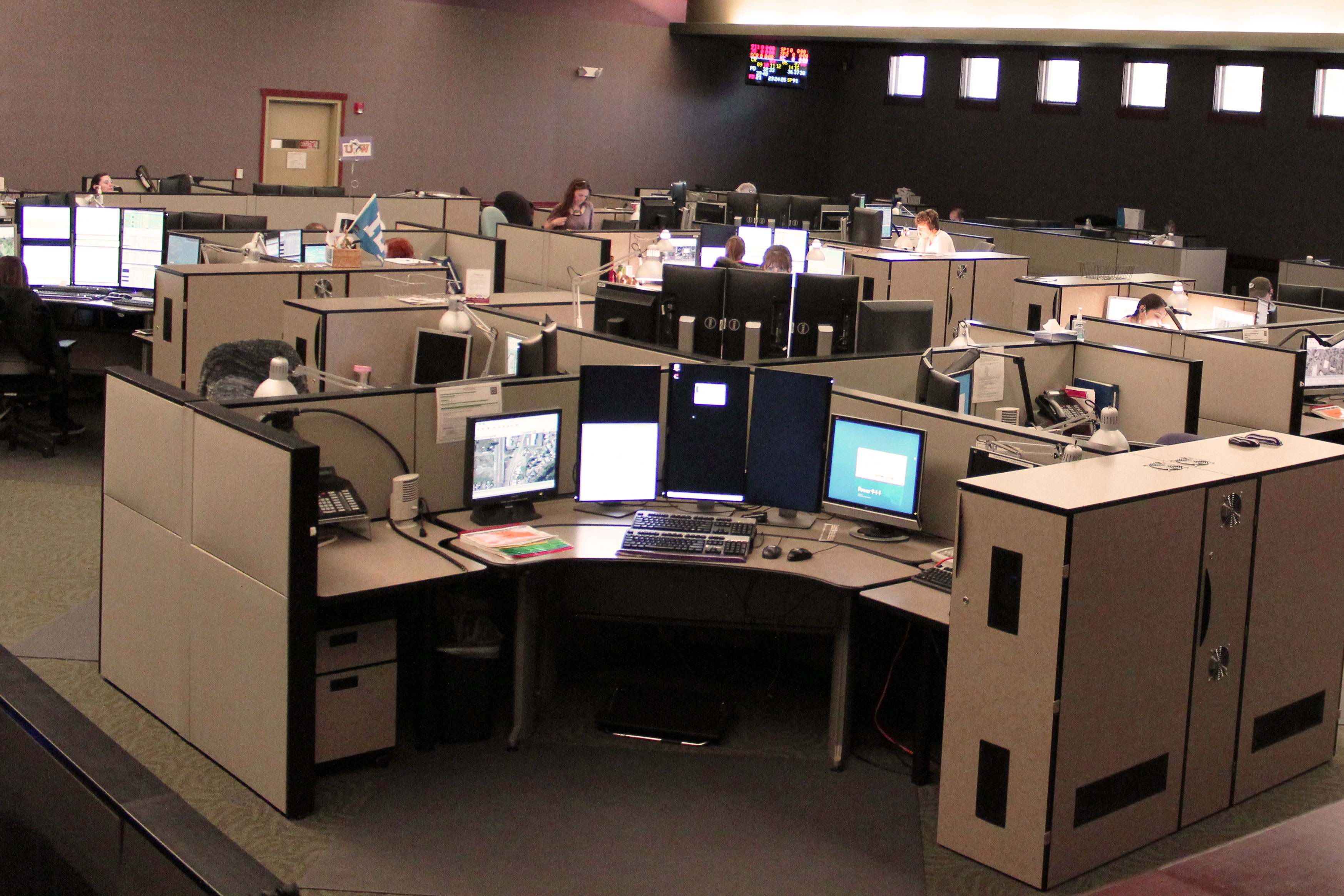 a photo of a call center floor with empty seats