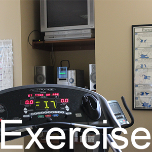 a treadmill and the word exercise