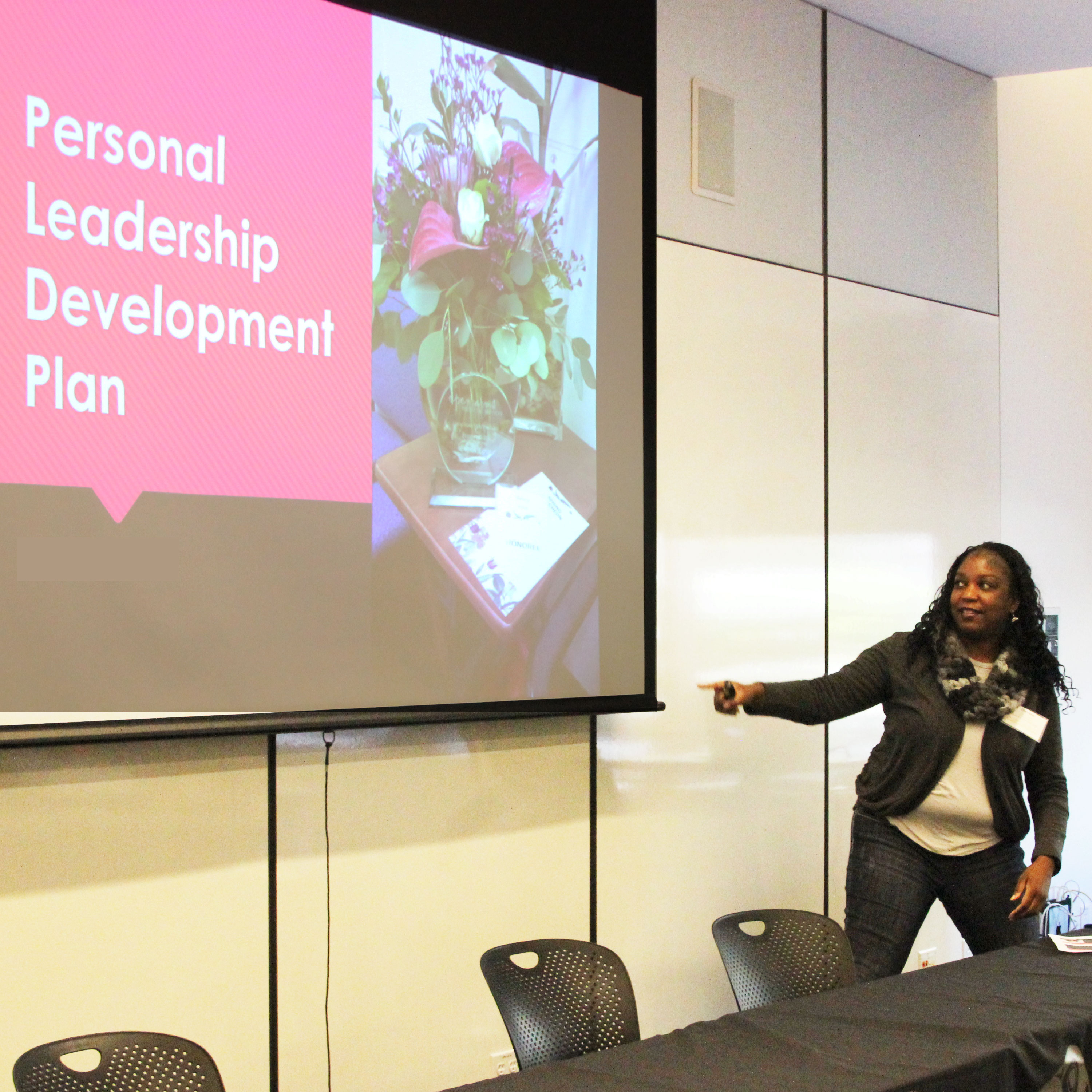 a manager at a training presenting on her personal leadership development plan
