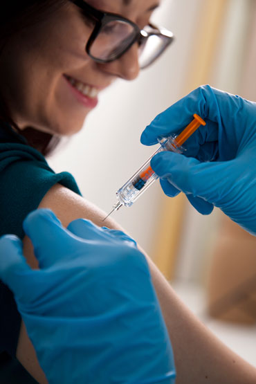 a woman getting a flu shot