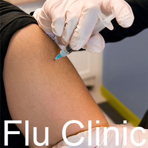 a patient receiving an injection and the words flu clinic