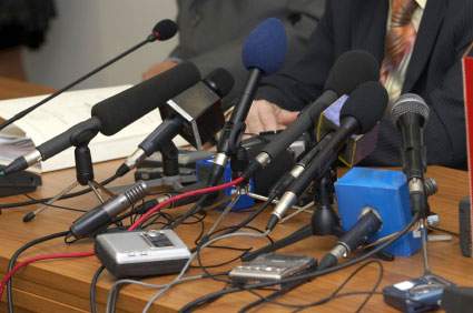 Microphones at a news briefing