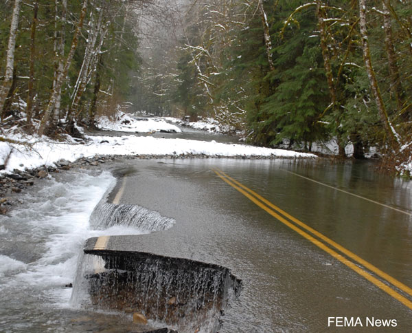 photo of a washed out road after a flood