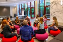 Scholars in discussion at an on-site session