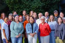 2024 NWCPHP Staff Group photo of all staff at NWCPHP standing outside and smiling