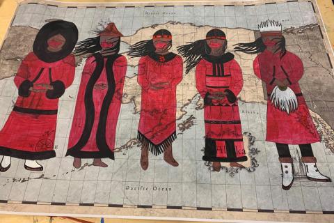 Mural showing five figures standing in front of a map of Alaska