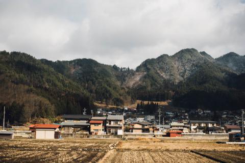 Photograph of rural town near hills