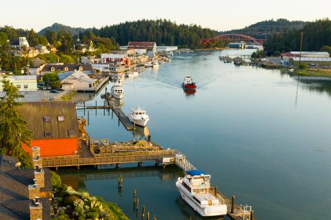 Photograph of a river waterfront next to a rural town.