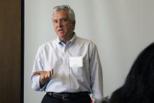 Photograph of Tom Eversole speaking to a group.