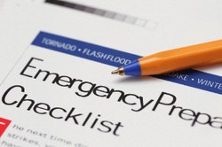 Photograph of a pen resting on an Emergency Preparedness Checklist.