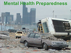 Photograph of cars with rubble as from a large scale disaster.