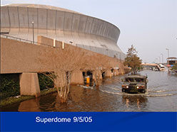 Photograph of the Superdome surrounded by flood waters.