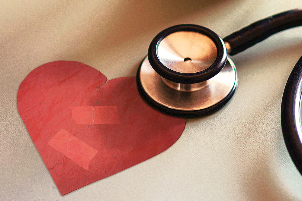 Photograph of a stethoscope resting on a hand-drawn heart.