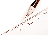 Photograph of a pencil next to a ruler.