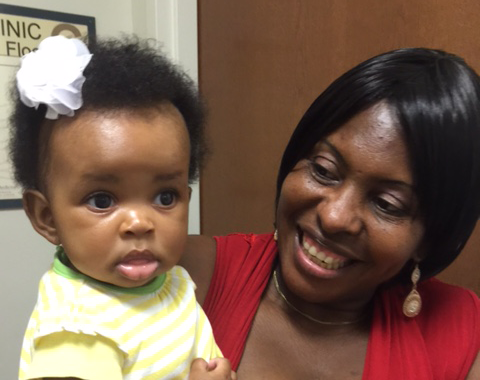 Photograph of a woman and a toddler.