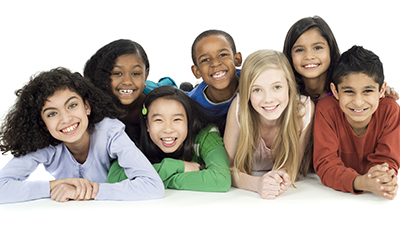 Photograph of several children posing for a picture.